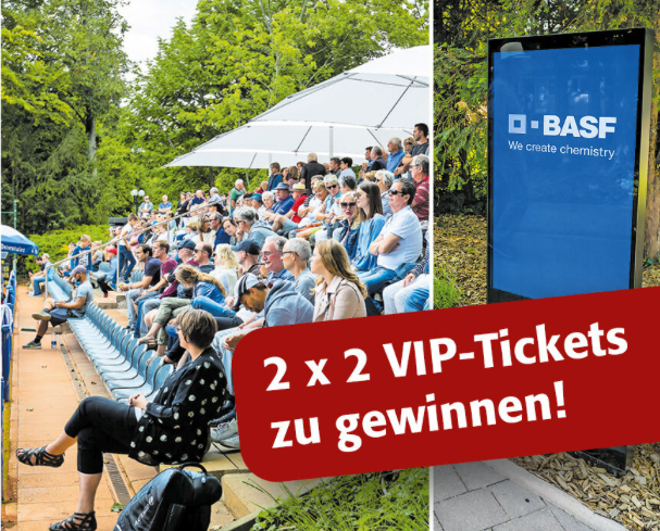 Publikum bei Outdoor-Event mit BASF Werbebanner