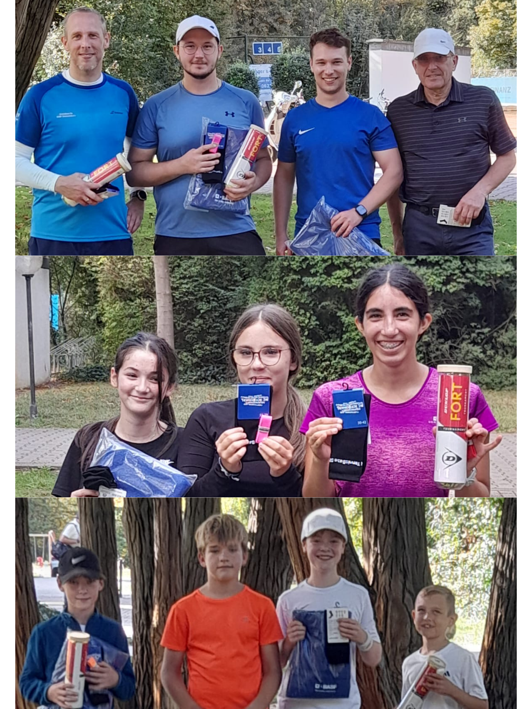 Gruppenfoto mit Sportlern und Preisen im Park